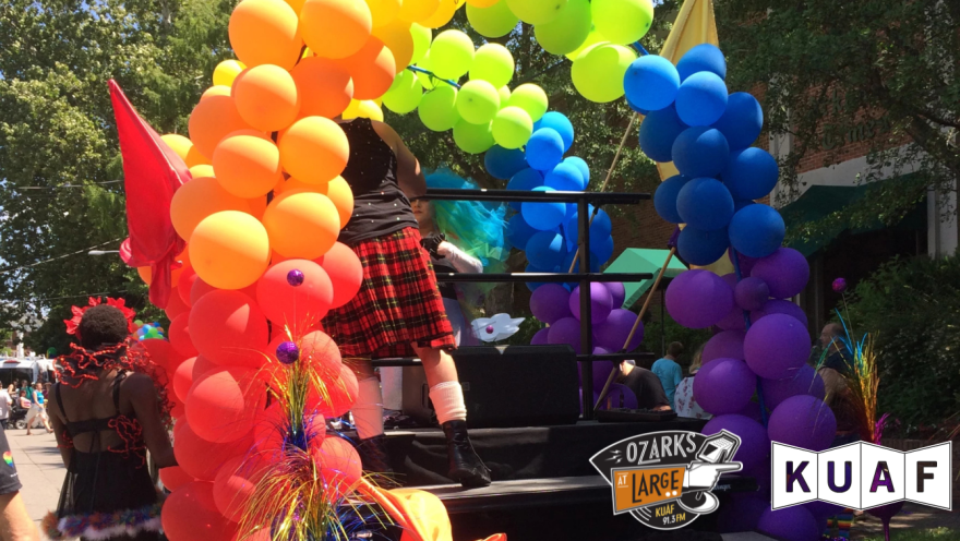 Float participants prepare to enter an annual Fayetteville Pride Parade, which despite efforts by the Trump administration to extinguish LGBTQ+ civil rights, will occur again this summer.