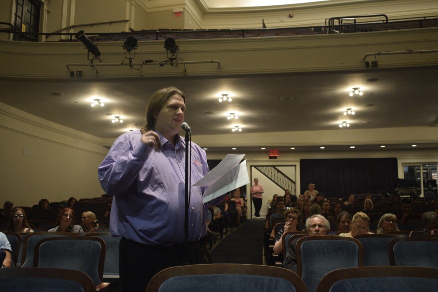 Zach Gittrich, one of the petitioners placing issues on the Township meeting’s agenda, spoke to a group of more than 100 at the Bloomington Center for Performing Arts Monday night.