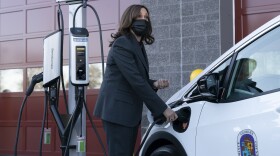 Vice President Harris charges an electric vehicle during a tour of the Brandywine Maintenance Facility in Prince George's County, Md. There, she highlighted electric vehicle investments.