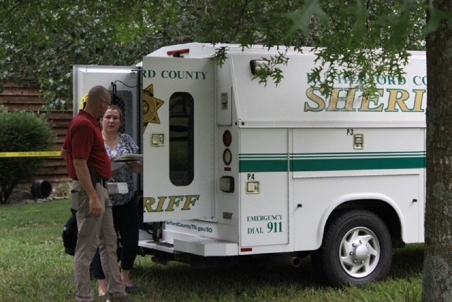 Rutherford County Sheriff’s Crime Scene detectives gather evidence after a fatal shooting Wednesday on Panther Creek Road.