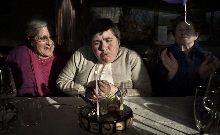 Monia is my sister. She has been disabled since birth. My mother takes care of her every day, every hour, always. Monia's world is a world away from everything else — solitary, confined, but not empty — where time is made up of moments, a present that does not need to project into the future.
