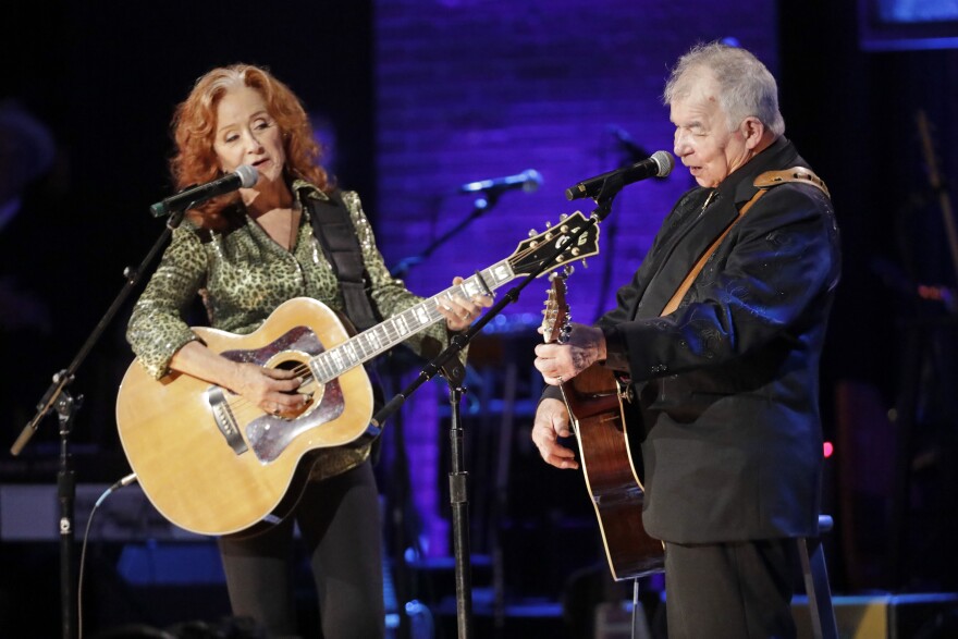 Bonnie Raitt, left, and John Prine perform during the Americana Honors & Awards show Wednesday, Sept. 11, 2019, in Nashville, Tenn. (AP Photo/Wade Payne)