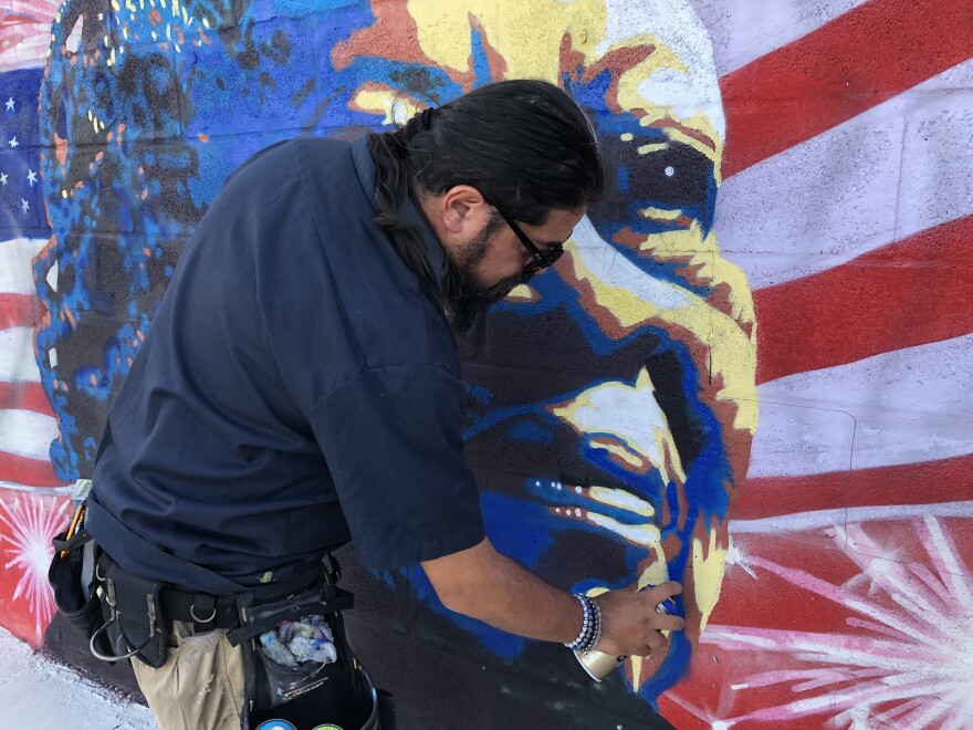 Cesar Aguilera, originally from Quito, Ecuador, has been a staple in the SWFL art scene. In 2015, he received the Gulfshore Life Emerging Arts Leader award. He is the art curator of the Sidney and Berne Davis Art Center’s Grand Atrium and Capital Gallery. He says spray paint has become a staple, even in his personal art, "Especially the backgrounds of my paintings, I use [spray paint] because it gives that depth and dimensionality on the background that I can't achieve with a brush. So, whenever I'm painting now, all of my backgrounds are done with spray paint."