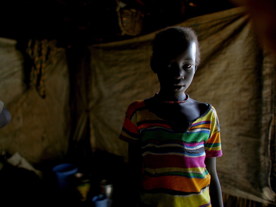 One of the camp's 124,000 residents in her shelter.