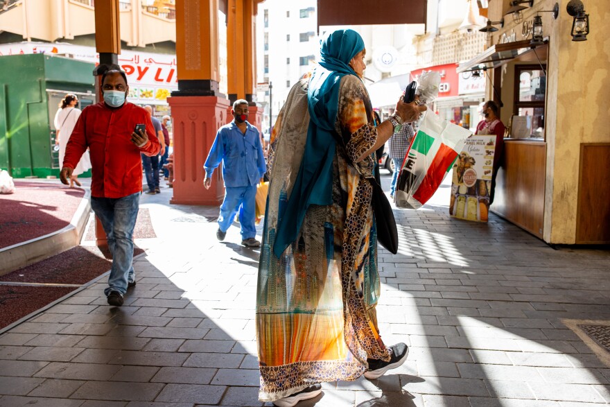 Israeli tour guide Lihi Ziv (center) walks through the Deira district near the Grand Souq in Dubai.