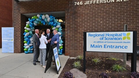 Democratic state Rep. Bridget Kosierowski (center) and state Sen. Marty Flynn (left) speak with Commonwealth Health president Michael Clark (center right) and Regional and Moses Taylor Hospitals CEO Dr. Patrick Conaboy (right) after Monday's ribbon cutting at Regional Hospital of Scranton.