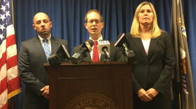 U.S. Attorney Ben Glassman (center) says there was nothing separate about this front company and Evans Landscaping controlled everything.