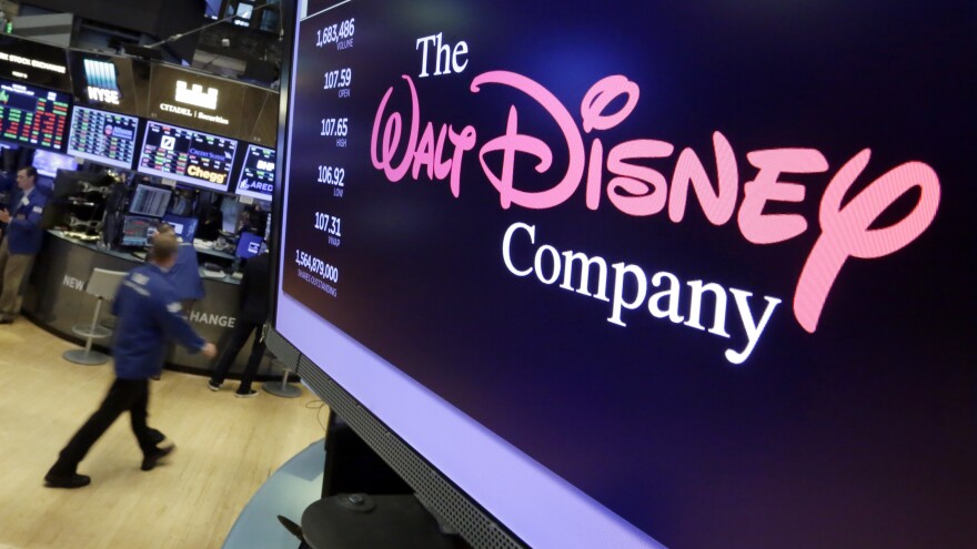 The Walt Disney Co. logo appears on a screen above the floor of the New York Stock Exchange.