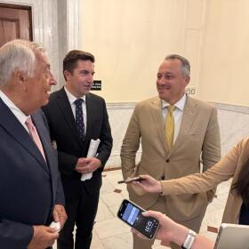 Mass. House Speaker Ron Mariano, Rep. Jack Patrick Lewis, and House Ways and Means Chair Aaron Michlewitz (pictured from left) gather to talk to reporters after a House Democrat caucus on July 15, 2026 at the State House. 