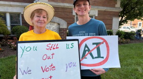 Phyllis Massingale and Aiden Packard protested a data center ordinance outside the Bowling Green City Commission meeting on June 16, 2026.