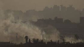 Smoke rises to the sky after an explosion in the Gaza Strip as seen from southern Israel, Monday, May 13, 2024. (AP Photo/Leo Correa)