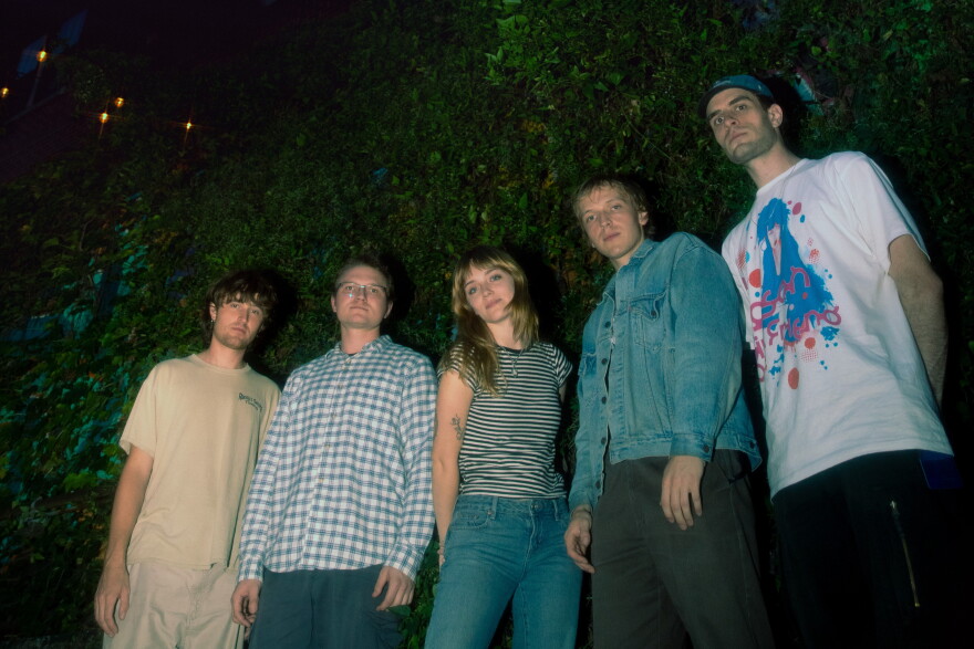 a group of individuals pose for a photograph 