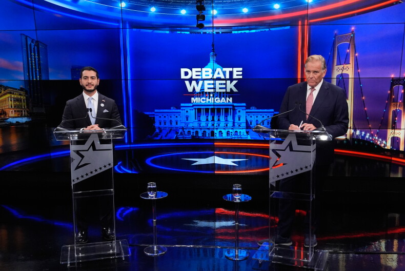 Democratic nominee for U.S. Senate Abdul El-Sayed, left, appears with Republican nominee for U.S. Senate Mike Rogers during a televised debate at WOOD-TV, on Thursday, Oct. 8, 2026, in Grand Rapids, Mich.