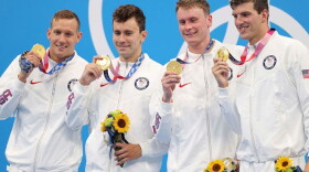 The United States' winning 400-meter freestyle relay team celebrates in Tokyo Sunday night.