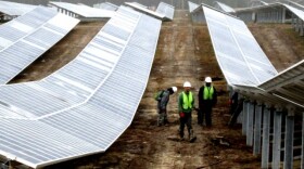 Construction workers monitor the a solar farm in Fuquay Varina