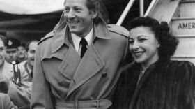 Danny Kaye arrives at London Airport with his wife, Sylvia Fine Kaye, in 1948.