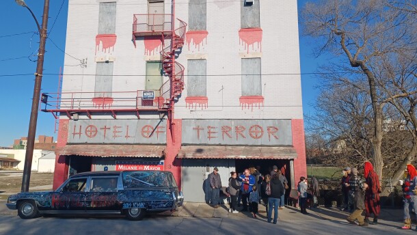 Supporters of letting the Hotel of Terror remain where it is gather in front of the business