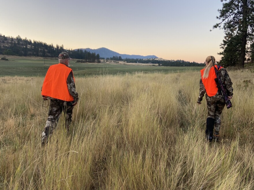 Bill and Julianne Hinkle walk to a spot where they can hunt deer.