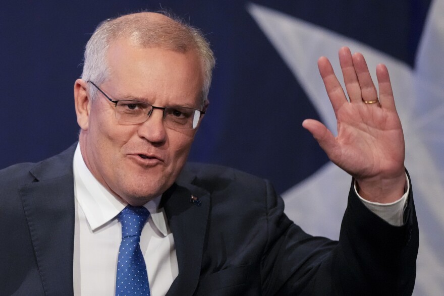 FILE - Then-Australian Prime Minister Scott Morrison waves as he arrives at a Liberal Party function in Sydney, Australia, Saturday, May 21, 2022. (AP Photo/Mark Baker)