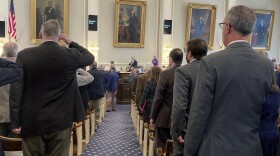 FILE - Members of the New Hampshire House recite the Pledge of Allegiance on March 10, 2022, in Concord, N.H. Unofficial results from the House clerk show an almost even partisan divide in the 400-member House after elections on Tuesday, Nov. 8, with 203 Republican winners and 197 Democrats. The Associated Press has not called many of the races, and recounts are likely. (AP Photo/Holly Ramer, File)