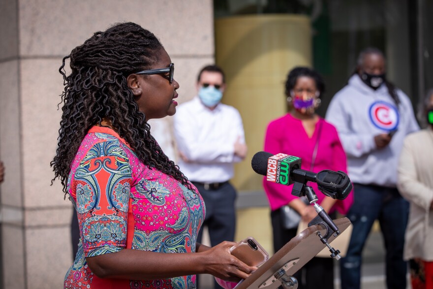 Aisha Dew from speaking at a press conference on April 20.