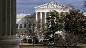 FILE - The Supreme Court is seen in the distance, framed through columns of the U.S. Senate at the Capitol in Washington, Feb. 20, 2025.