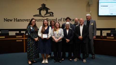 NHCS board on December 2, 2025. Second from left: Teacher Ashley Frye was honored and pictured.