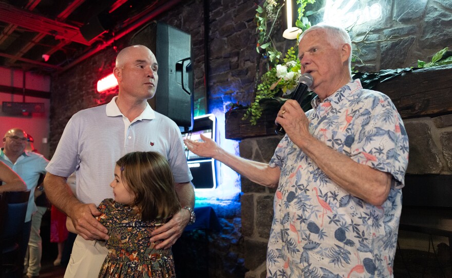 Lackawanna County Commissioner Thom Welby, right, speaks while Senator Marty Flynn and his daughter, Aria, look on during an Election Night party for Flynn's primary re-election bid for the Pennsylvania 22nd Senate District at Benny's of Downtown in Scranton on Tuesday, May 19, 2026.