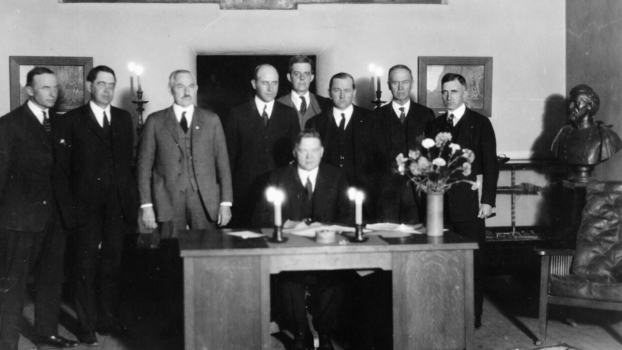 In this photo provided by the U.S. Bureau of Reclamation, Commerce Secretary Herbert Hoover presides over the signing of the Colorado River Compact in Santa Fe, N.M., on Nov. 24, 1922. Seven land-owning white men brokered a deal to allocate water from the Colorado River, which winds through the West and ends in Mexico. (U.S. Bureau of Reclamation via AP)