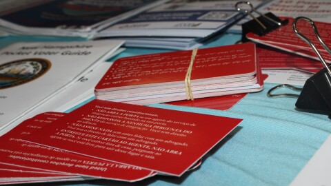 Red cards at a Justice Fair held at Concordia Lutheran church on Feb. 8, 2025.