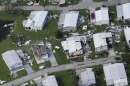 Homes that sustained wind damage caused by Hurricane Ian are seen in this aerial view, Thursday, Sept. 29, 2022, in Fort Myers, Fla. (AP Photo/Marta Lavandier)