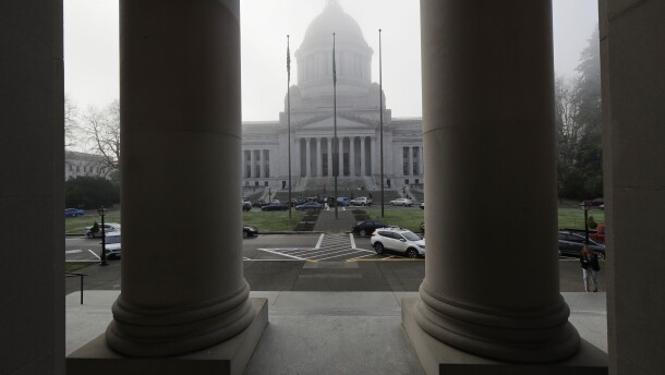 The Legislative Building is viewed in a light morning fog through the columns of the Temple of Justice, Jan. 14, 2019, at the Capitol in Olympia, Wash., on opening day of the Washington Legislature.