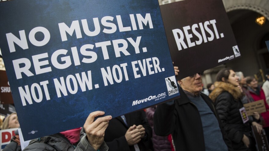 Demonstrators march from the Department of Justice to the White House in December 2016 to protest the National Security Entry-Exit Registration System program and then-President-elect Donald Trump's plan to restrict travelers from Muslim countries