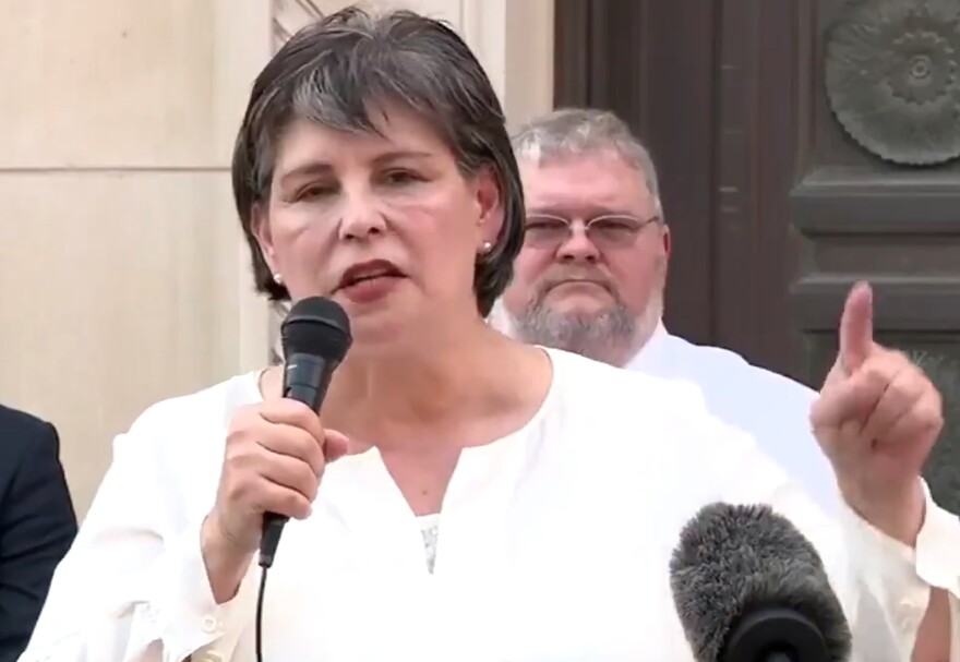 Bexar County Republican Party Chair Cynthia Brehm speaking to a crowd.