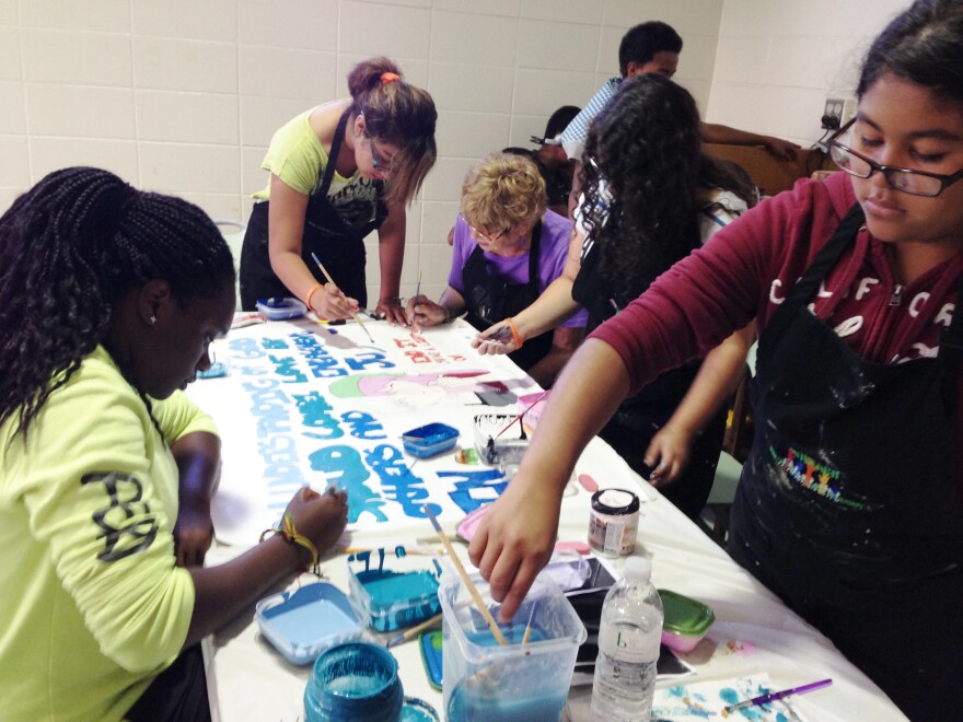 Students Making an ARTREACH Banner