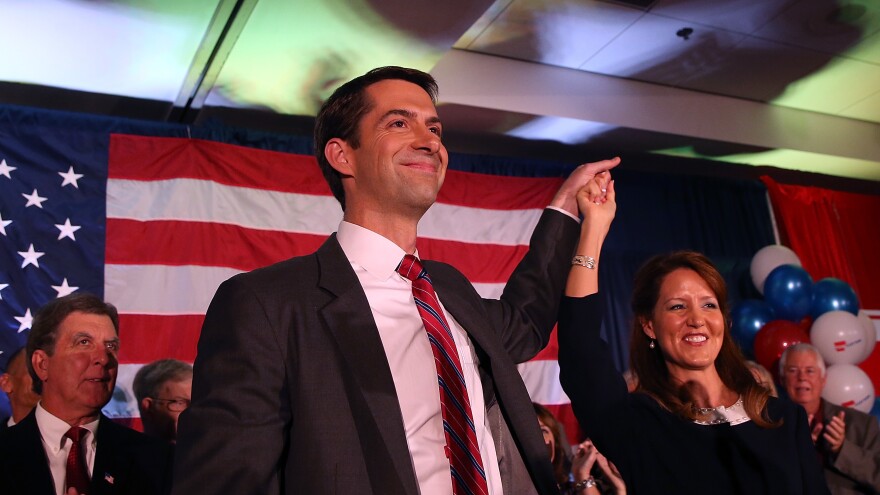 Arkansas Republican Sen. Tom Cotton and his wife, Anna Peckham, greet supporters during an election night gathering on Nov. 4, 2014.