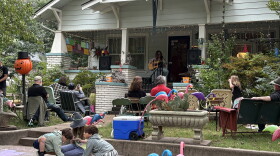 Audience members take in a performance as children play during Norman's annual Porchfest on Saturday, Oct. 3 2026.