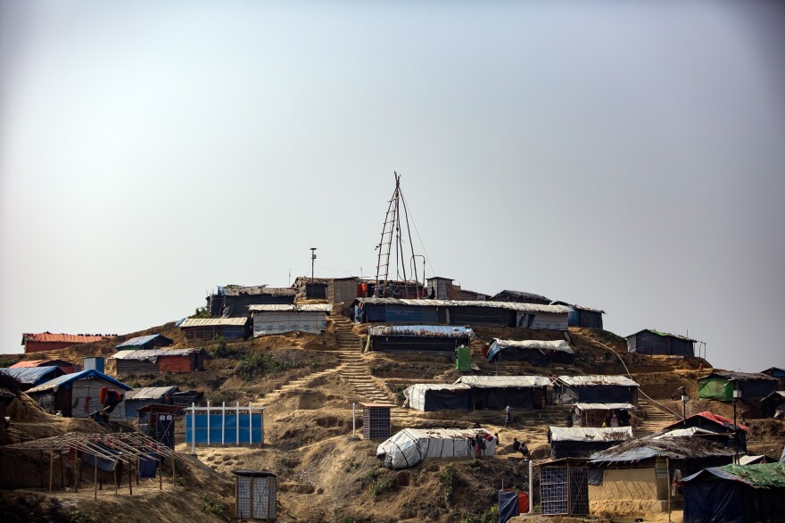 The rigging to drill a new water well tops a hill in the Kutupalong camp.