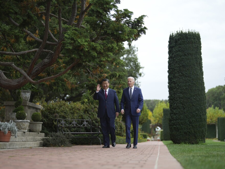 President Joe Biden and China's President President Xi Jinping walk in the gardens at the Filoli Estate in Woodside, Calif., on Wednesday on the sidelines of the Asia-Pacific Economic Cooperative conference.