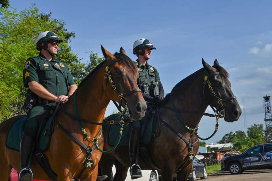 Two Sarasota County Sheriff's deputies on horseback.