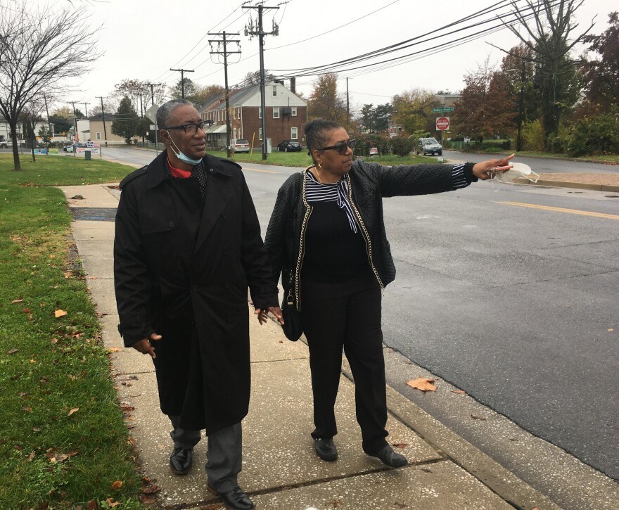 Michael Hancock and Olivia Lomax walk along Sollers Point Road in Turner Station which often floods.