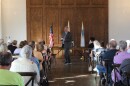 Congressman Eric Sorensen hosts a town hall in Peoria Ill. A crowd sits and listens. 