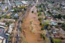 An aerial shot of Bear Creek in Merced is shown after heavy rains in January 2023 resulted in water flooding into residential areas.