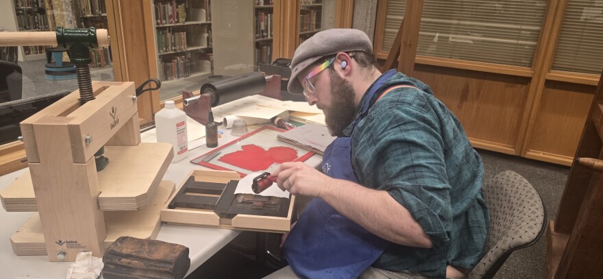 Sata Prescott working on books for May event.