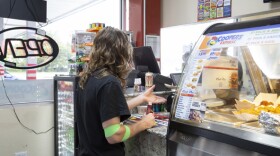 A customer buys cigarettes at KwikRun, 4309 E. Reno Ave. in Oklahoma City.
