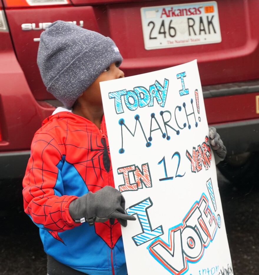 A young marcher holds up his sign at the St. Louis Women's March on January 19, 2019.