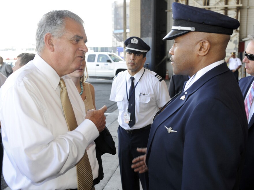 U.S. Transportation Secretary Ray LaHood (left) talks to American Airlines pilot Jesse Perkins after a news conference in New York on Monday.