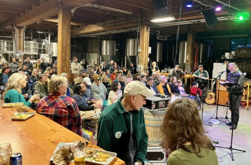 Dave Densmore reads his work at the Fort George Brewery in Astoria as part of the FisherPoets Gathering’s annual event.