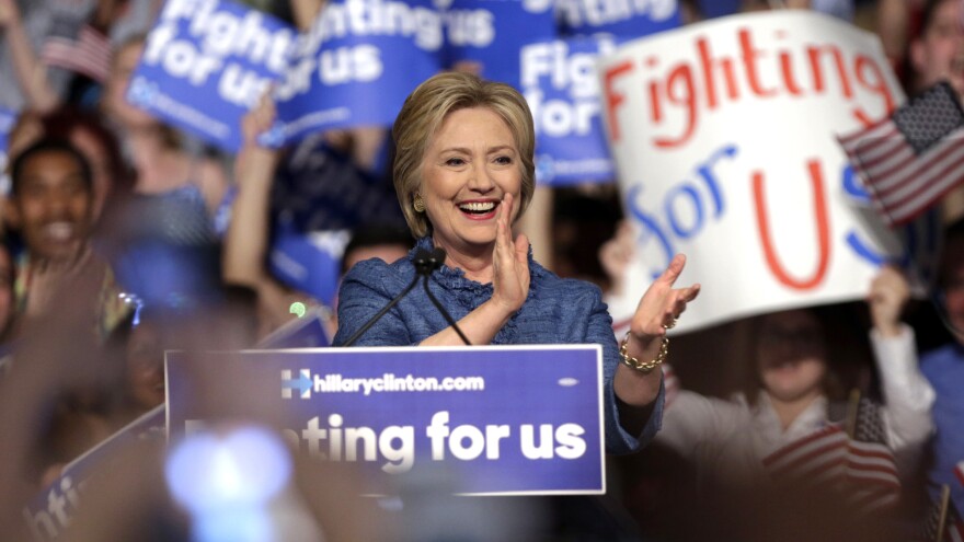 Hillary Clinton applauds during her victory speech in Florida Tuesday.