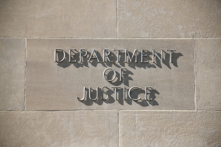 "Department of Justice" sign.